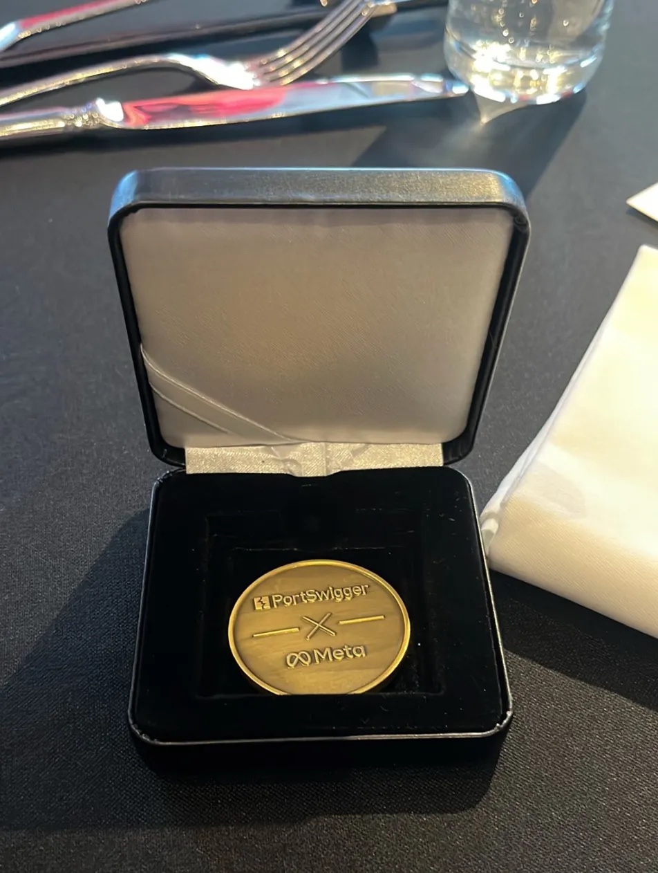 PortSwigger and Meta award medal in a presentation box